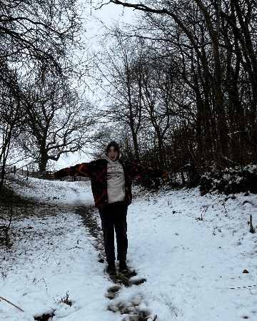 Photo of Courtney standing in the snow